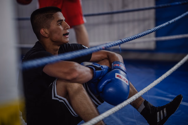 Boxer resting in the ring after training at Ringside Gym